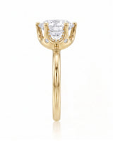 Estelle 1 carat F-colour round natural diamond crown solitaire ring in 18K yellow gold, side profile showing raised open crown basket | SARATTI