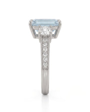 Étoile Trinity emerald cut Aquamarine three-stone diamond ring setting in Platinum, side profile | SARATTI