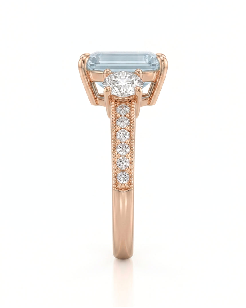 Étoile Trinity emerald cut Aquamarine three-stone diamond ring setting in Rose Gold, side profile | SARATTI