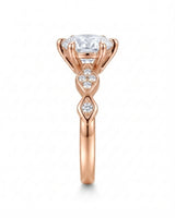 Florence 1 carat round natural diamond engagement ring in 18K rose gold, side profile showing six-prong crown | SARATTI