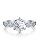 Florence 1 carat round natural diamond engagement ring in 18K white gold, front view of geometric diamond shoulders | SARATTI
