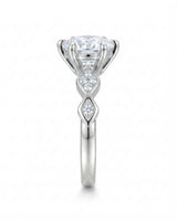 Florence 1 carat round natural diamond engagement ring in 18K white gold, side profile showing six-prong crown | SARATTI
