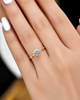 Florence 1 carat round natural diamond geometric engagement ring in 18K yellow gold, worn on hand | SARATTI
