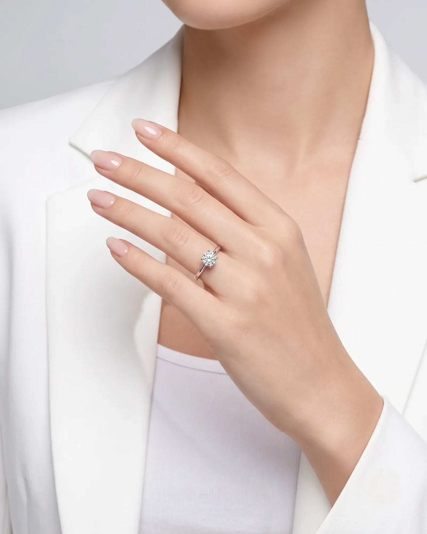 FORIA 1 carat round natural diamond sculpted solitaire ring in 18K white gold, worn on hand | SARATTI