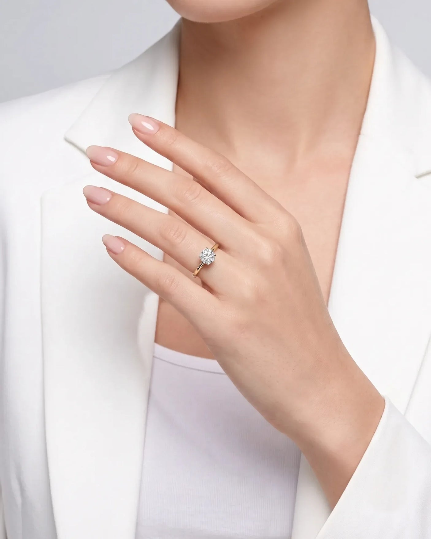FORIA 1 carat round natural diamond sculpted solitaire ring in 18K yellow gold, worn on hand | SARATTI