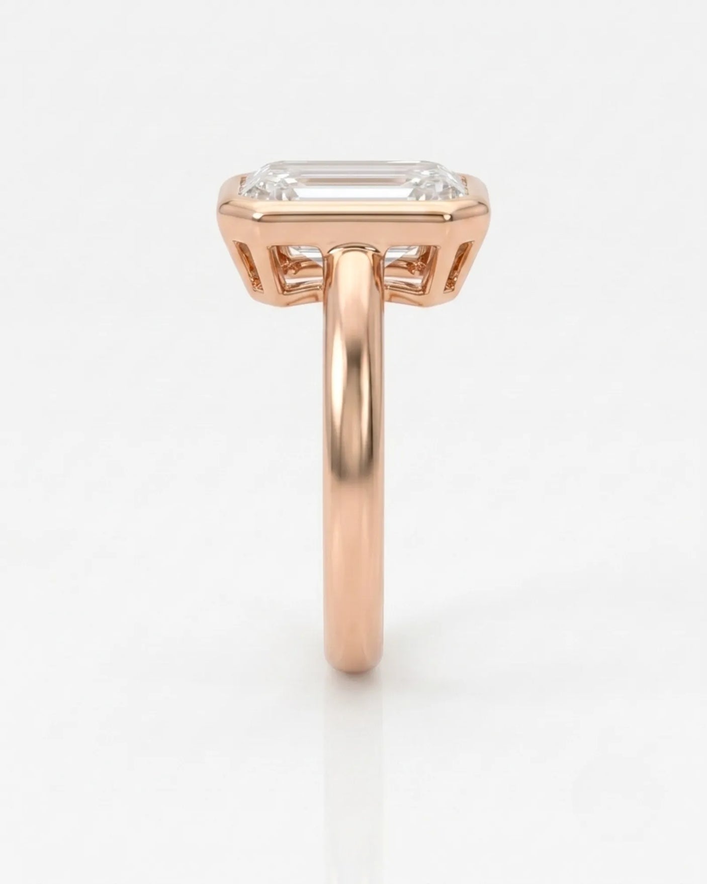 Golden Horizon natural emerald cut diamond bezel engagement ring in rose gold side profile | SARATTI