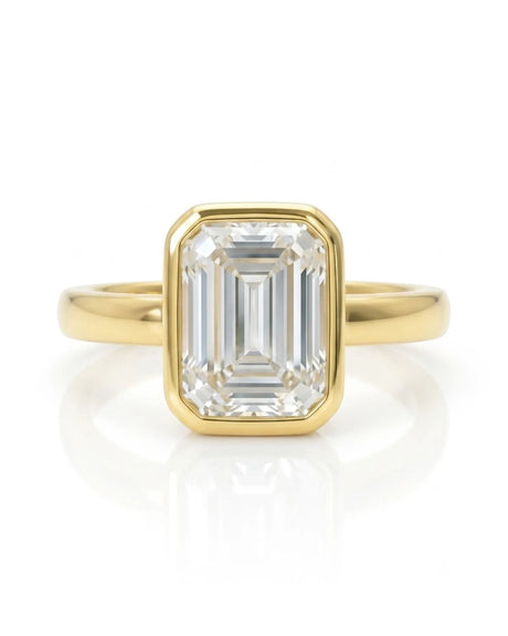 2 carat GIA-certified natural emerald cut diamond bezel ring front view in yellow gold | SARATTI