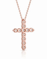 Rear angle of Grande Lueur Croix diamond cross necklace in rose gold | SARATTI