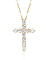Front view of Grande Lueur Croix round diamond cross necklace in yellow gold | SARATTI