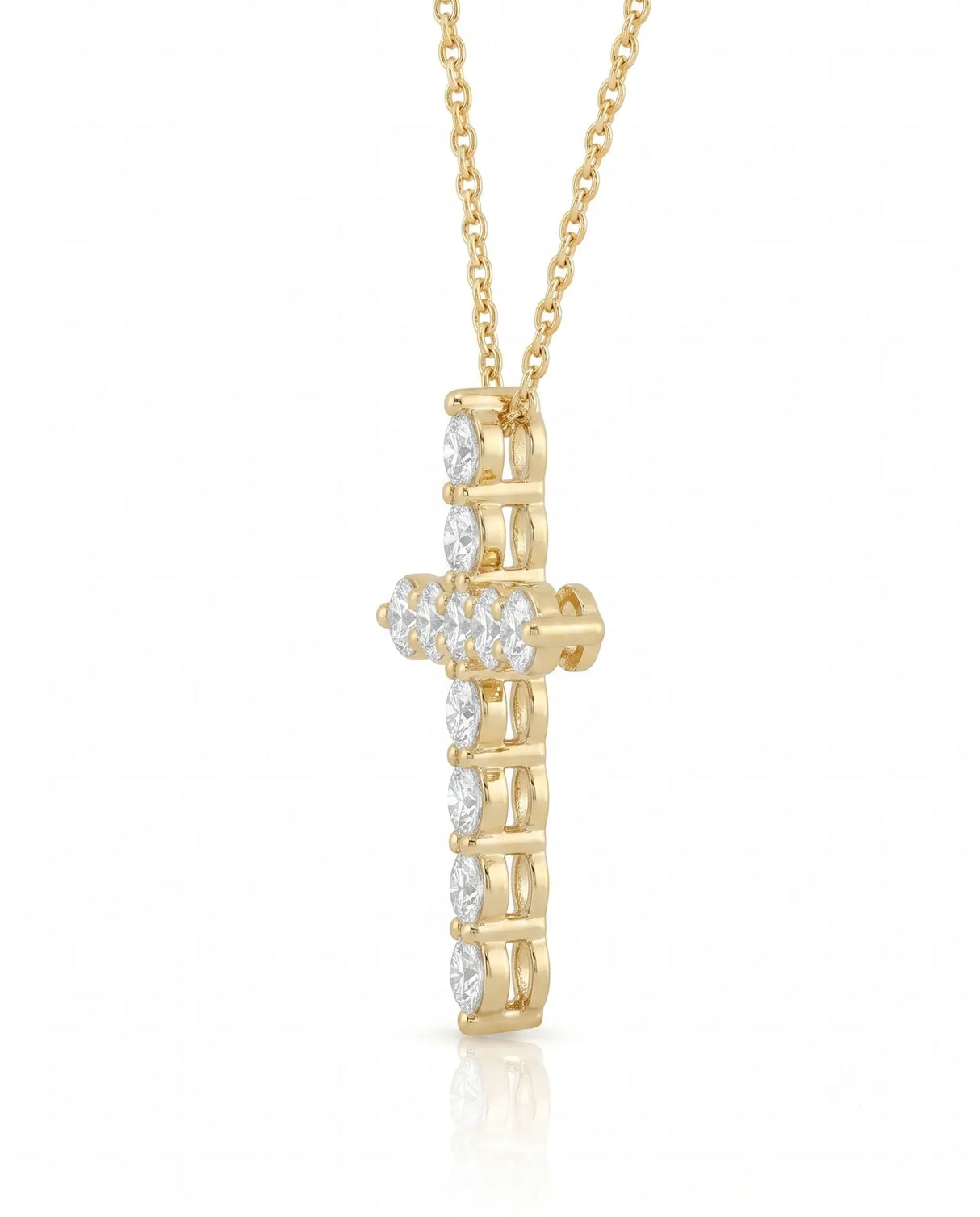 Side profile of Grande Lueur Croix diamond cross pendant in yellow gold | SARATTI