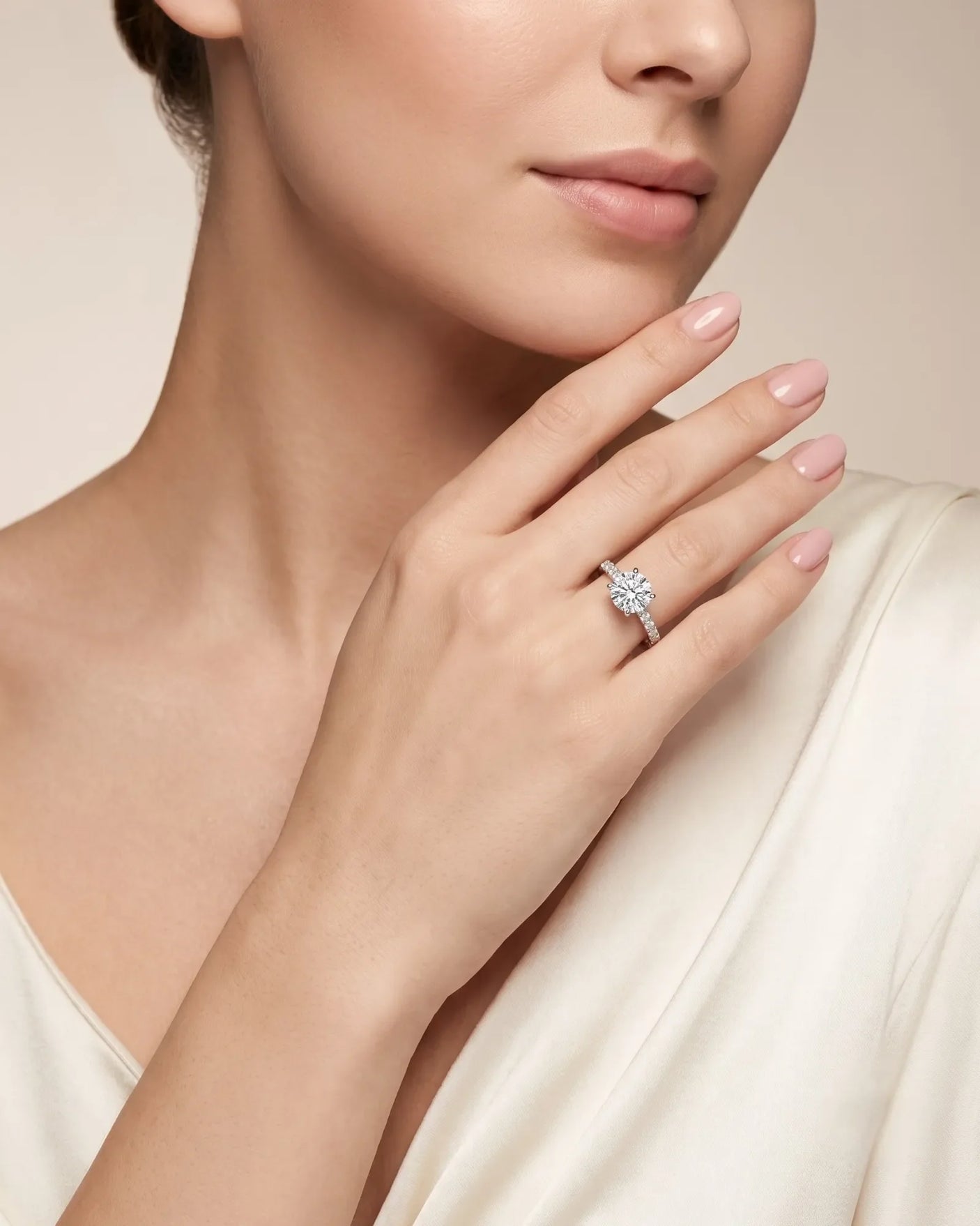Jelena 1 carat F-colour oval natural diamond pavé solitaire ring in platinum, worn on hand | SARATTI