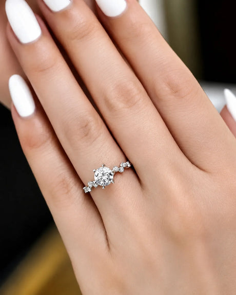 Joan 1 carat round natural diamond six-prong engagement ring in 18K white gold, worn on hand | SARATTI