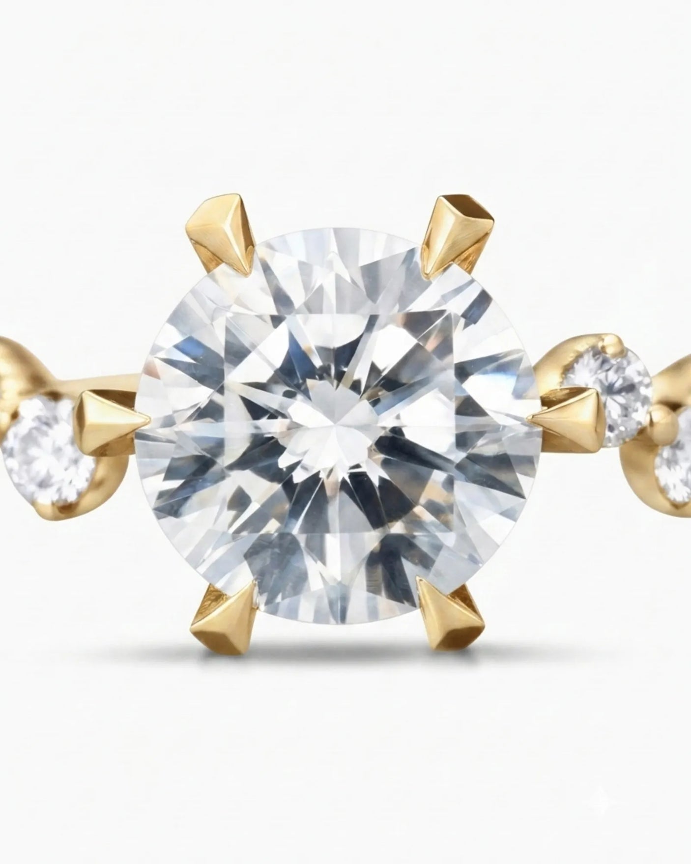 Joan 1 carat round natural diamond six-prong engagement ring in 18K yellow gold, macro detail of graduated round brilliant diamond side stones | SARATTI