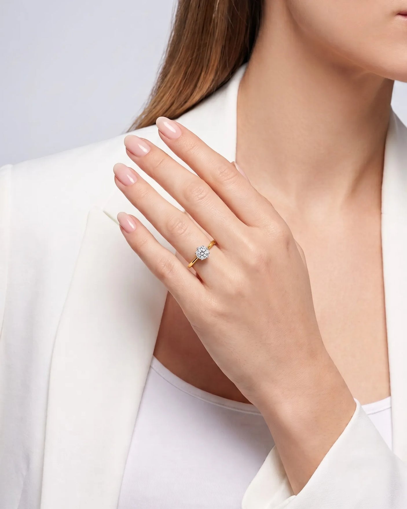 KATYA 1 carat round natural diamond heart-prong solitaire ring in 18K yellow gold, worn on hand | SARATTI