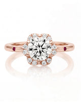 LILA 1 carat round natural diamond halo engagement ring with natural ruby shoulder accents in 18K rose gold, front view of floral diamond halo | SARATTI