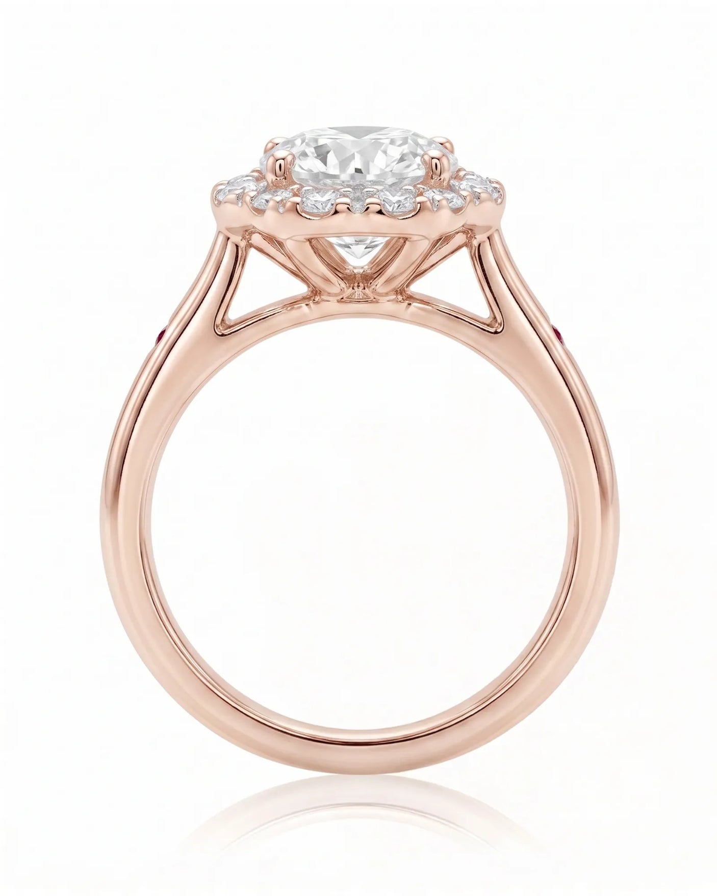 LILA 1 carat round natural diamond halo engagement ring with natural ruby shoulder accents in 18K rose gold, side profile showing four-prong crown and open gallery | SARATTI