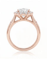 LILA 1 carat round natural diamond halo engagement ring with natural ruby shoulder accents in 18K rose gold, side profile showing four-prong crown and open gallery | SARATTI