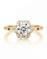 LILA 1 carat round natural diamond halo engagement ring with natural ruby shoulder accents in 18K yellow gold, front view of floral diamond halo | SARATTI