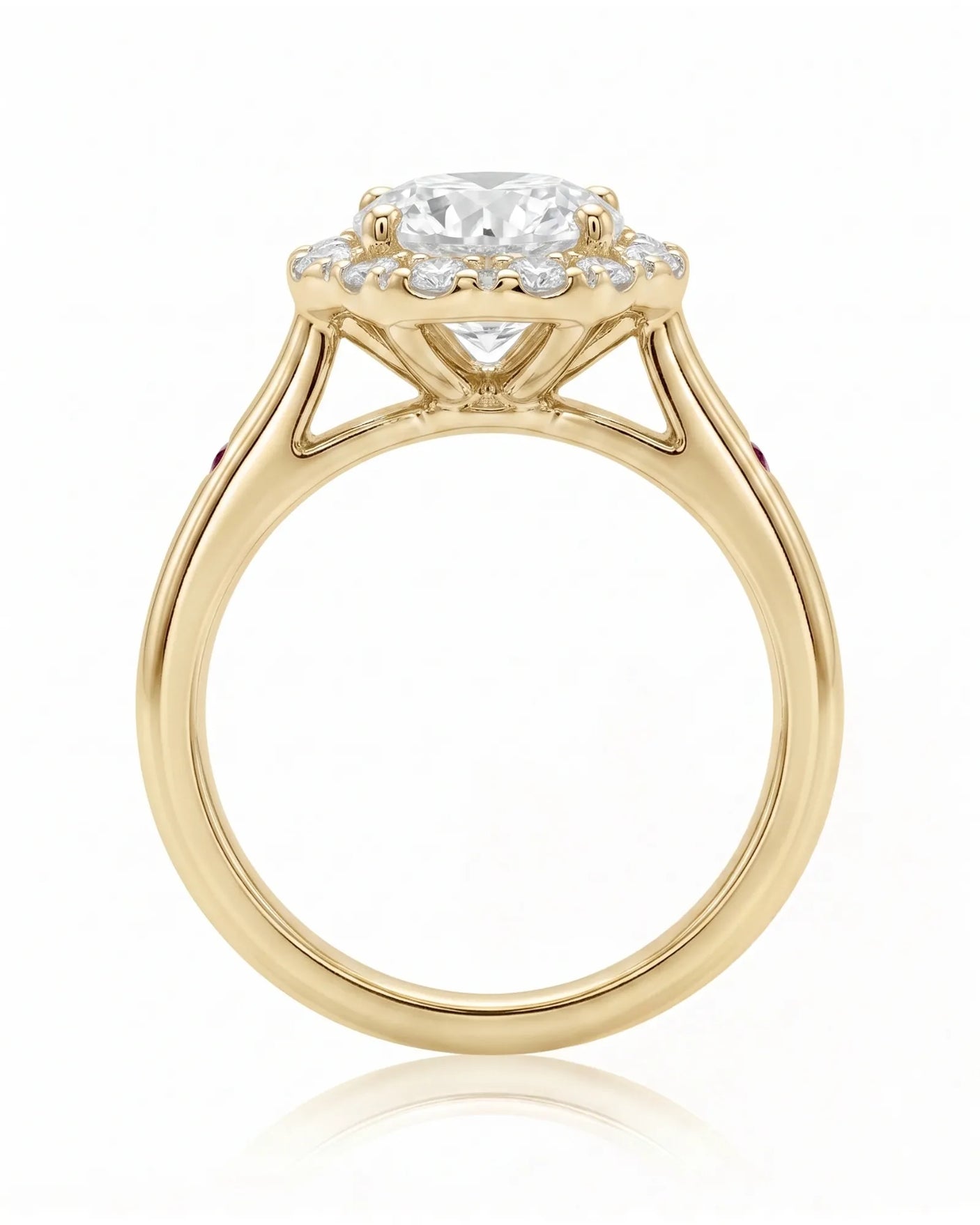 LILA 1 carat round natural diamond halo engagement ring with natural ruby shoulder accents in 18K yellow gold, side profile showing four-prong crown and open gallery | SARATTI