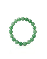 Round apple green jadeite beads showing natural-looking tonal variation | SARATTI