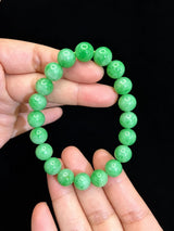 Apple green jadeite bracelet in angled product view showing round polished beads | SARATTI