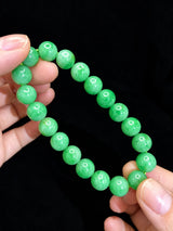 LUCIA polished jadeite bead surface and green colour detail close-up | SARATTI