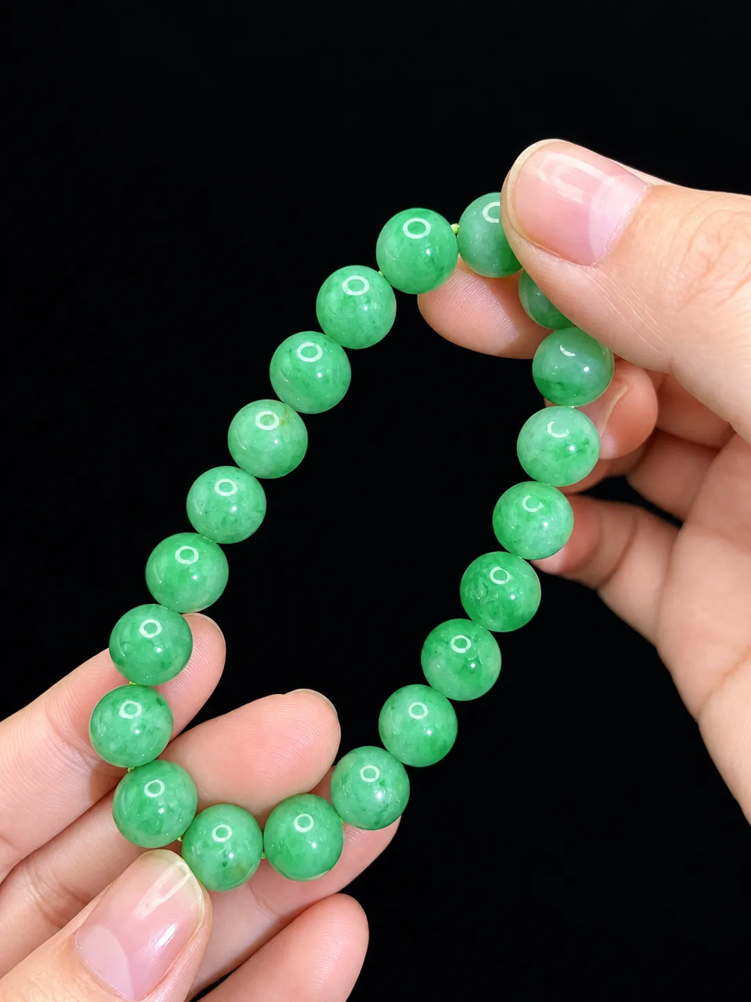LUCIA apple green jadeite bead bracelet held in hand for scale | SARATTI