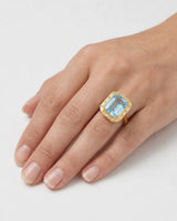 Lumière Octave emerald-cut Aquamarine baguette diamond halo ring setting in yellow gold, worn on hand | SARATTI