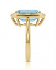 Lumière Octave emerald-cut Aquamarine ring setting in yellow gold, side profile with open geometric gallery and plain shank | SARATTI