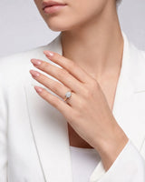 LUNA 1 carat round natural diamond four-prong engagement ring with natural diamond shoulders in 18K rose gold, worn on hand | SARATTI
