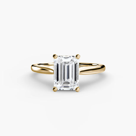 LYRA Emerald Cut twisted shoulder solitaire ring setting in Yellow Gold | SARATTI
