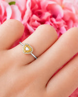 Maureen pear-shaped natural yellow diamond double halo ring in white gold, worn on hand | SARATTI