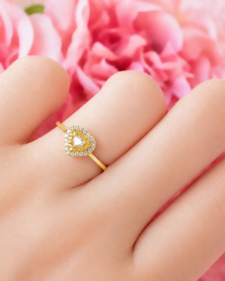 Maureen pear-shaped natural yellow diamond double halo ring in yellow gold, worn on hand | SARATTI