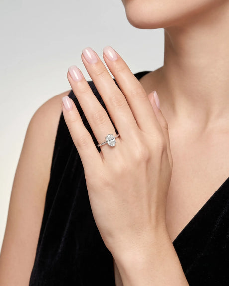 MIA 1 carat F-colour oval natural diamond cathedral solitaire ring in 18K white gold, worn on hand | SARATTI