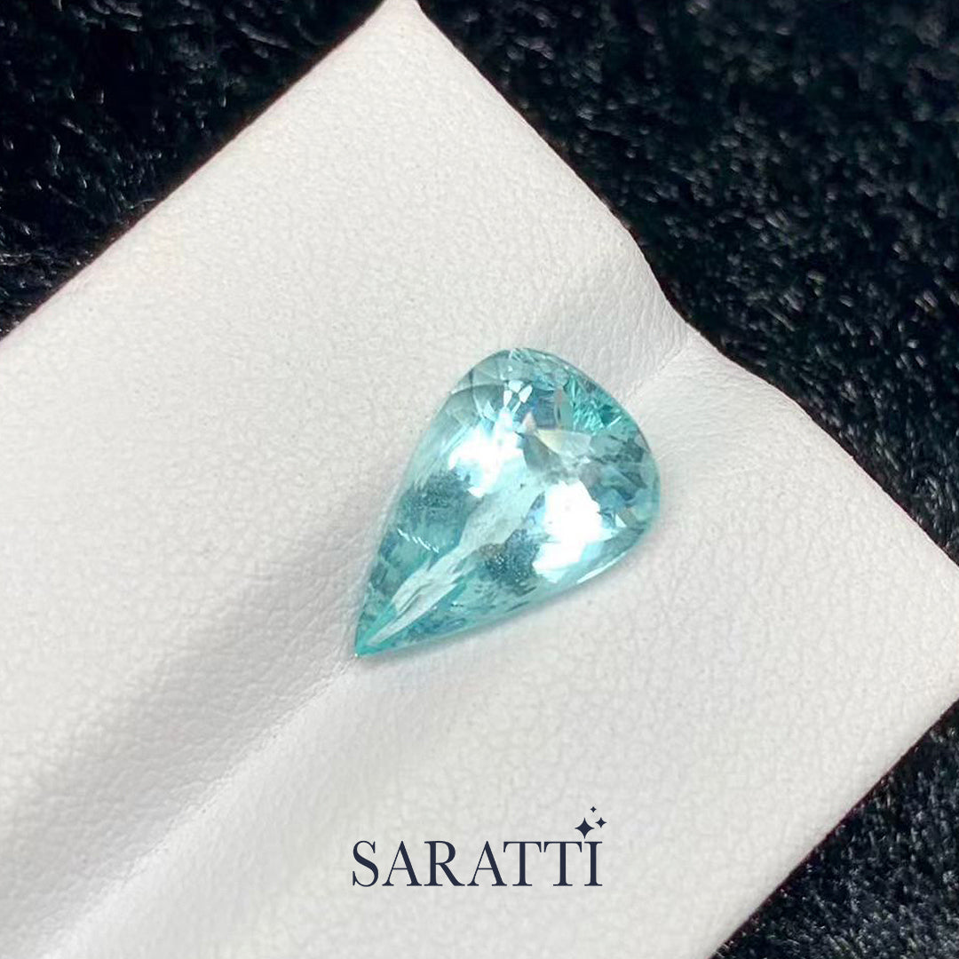 natural light blue tourmaline pear shape loose gemstone detail shot | SARATTI