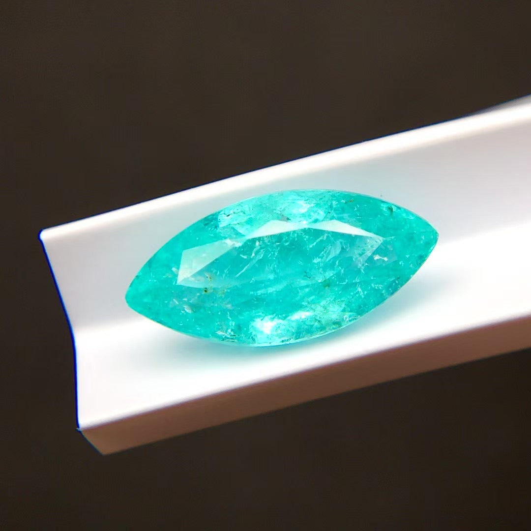 natural neon blue tourmaline marquise cut gemstone high clarity macro | SARATTI