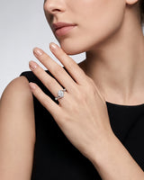 NERA 1 carat round natural diamond bypass split-shank engagement ring in platinum, worn on hand | SARATTI