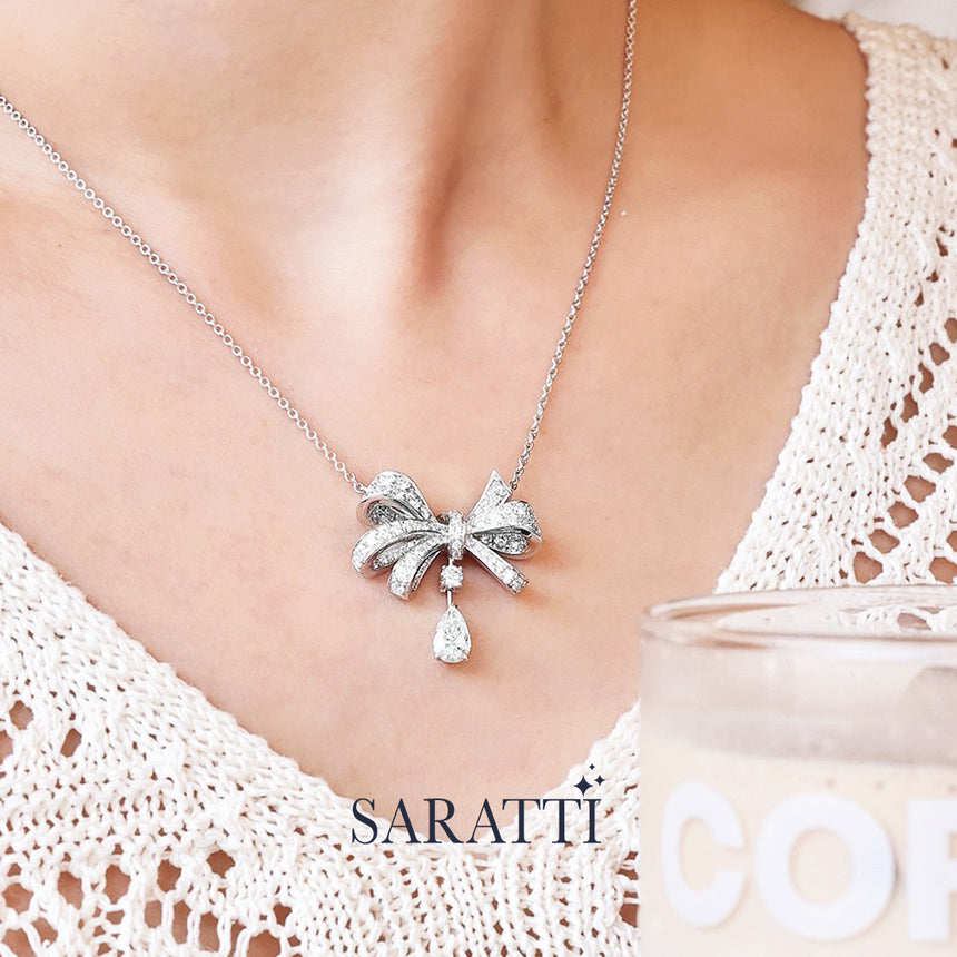 Feminine ribbon bloom diamond jewelry set on a model | SARATTI