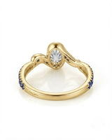 olorless oval moissanite framed by vivid blue sapphires in polished yellow gold | SARATTI