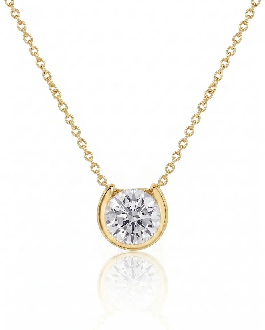 Petite bezel round diamond solitaire necklace in 18K Yellow Gold, front view | SARATTI