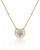 Petite bezel round diamond solitaire necklace in 18K Yellow Gold, front view | SARATTI