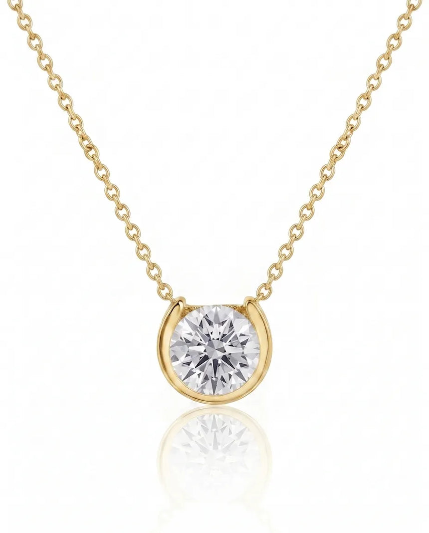 Petite bezel round diamond solitaire necklace in 18K Yellow Gold, front view | SARATTI