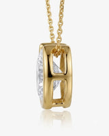 18K Yellow Gold bezel diamond solitaire necklace, side profile view | SARATTI