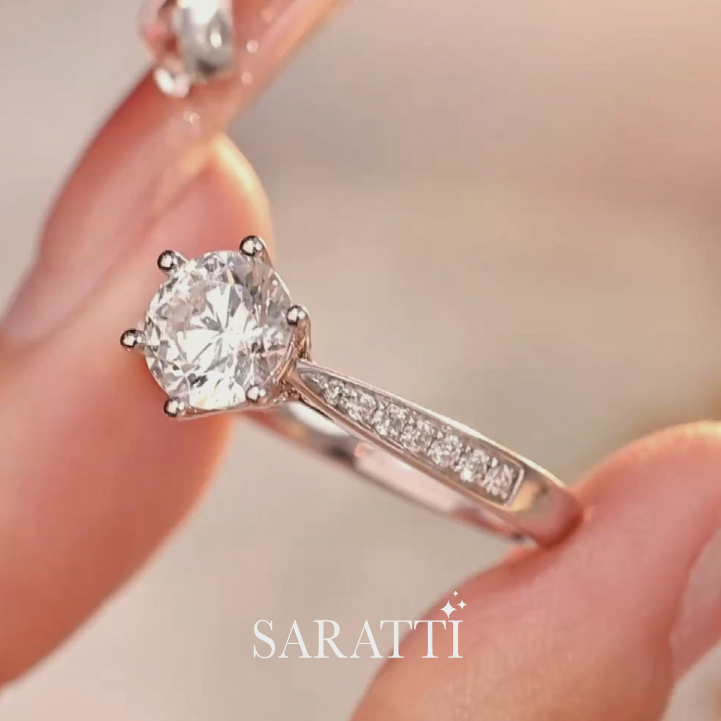 Luxury round diamond proposal ring with elevated prong setting and pavé 18K white gold band - SARATTI