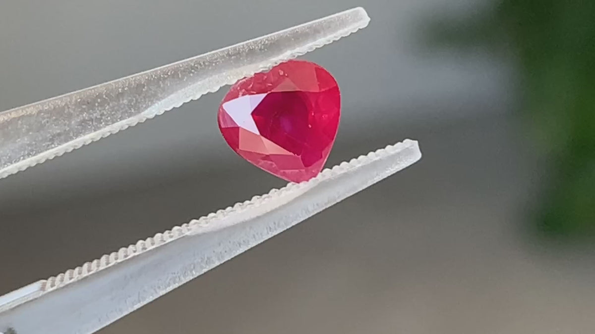 Close detail of a Natural Burmese Ruby showing bright red colour and natural crystal features | SARATTI