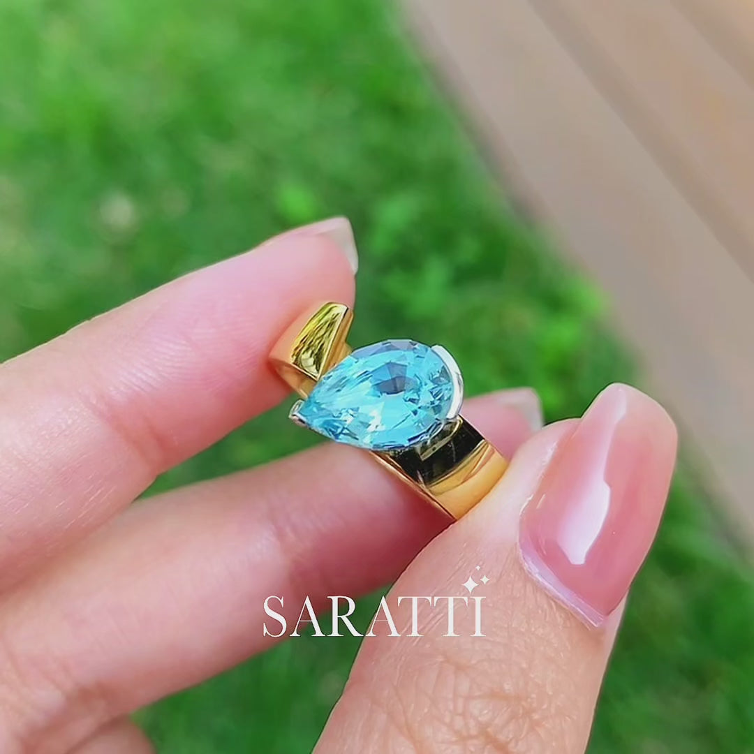Luxury pear aquamarine statement ring with bold gold silhouette in 18K Yellow Gold | SARATTI