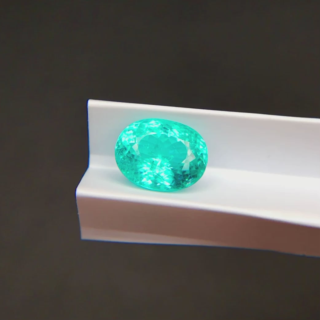 Natural Mozambique Paraiba Tourmaline oval faceted gemstone showing bright colour reflections | SARATTI