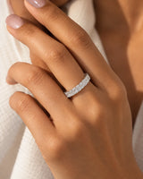 Radiant cut diamond eternity band in platinum worn on model | SARATTI