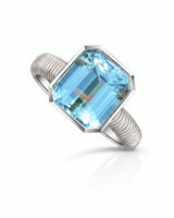 Rivage Bezel emerald-cut Aquamarine ribbed bezel solitaire ring setting in Platinum, 45-degree view | SARATTI