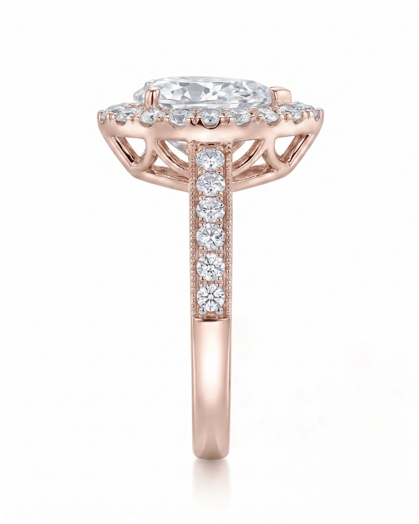ROSE 1 carat F-colour pear natural diamond halo ring in 18K rose gold, side profile showing raised halo gallery | SARATTI